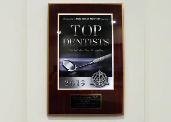 Framed plaque reading Top Dentists, as published in New Jersey Monthly, July 2019, selected by peer recognition, awarded to Richard Lukenda, DMD
